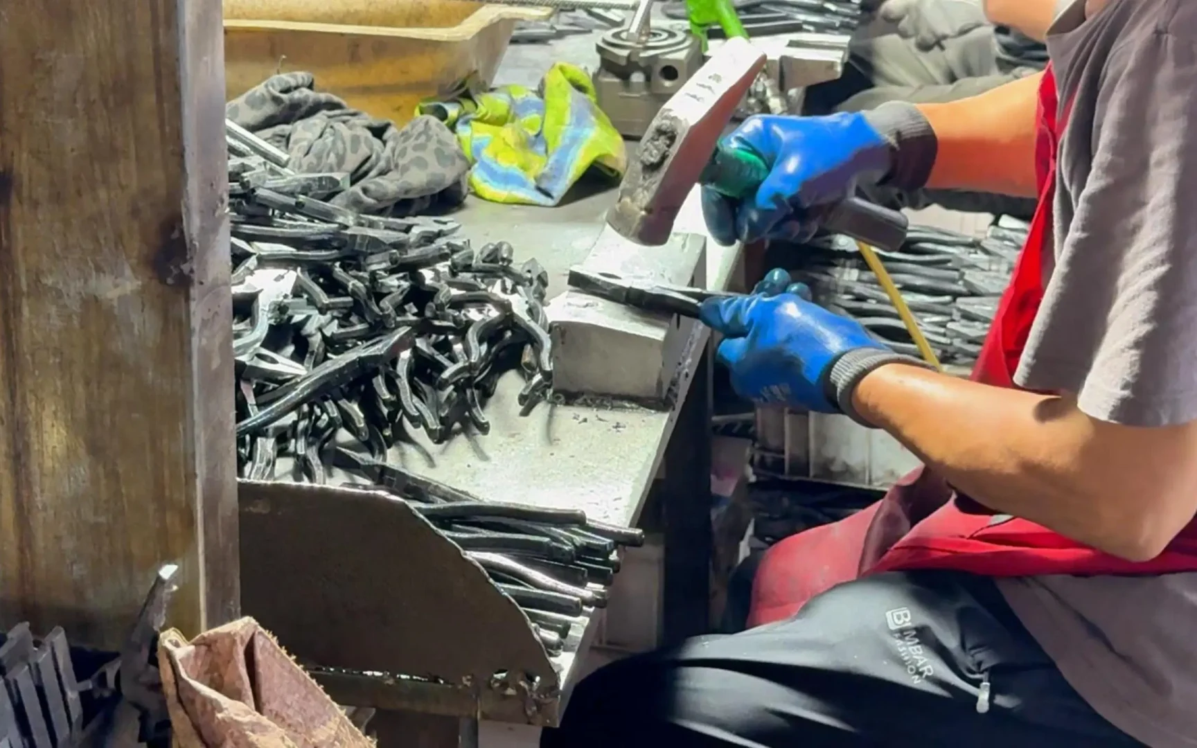 Worker hand‑calibrating CR‑V combination plier semi‑finished goods, Huashutools www.huashutools.com
