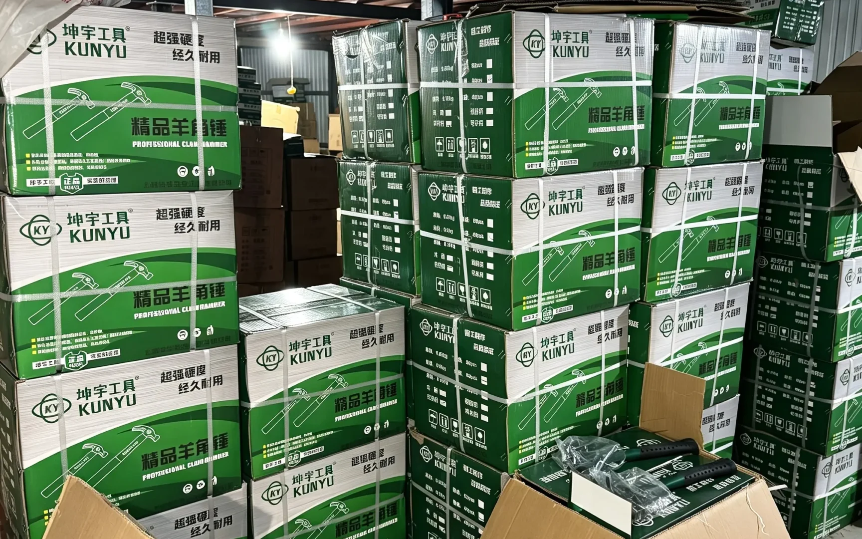 Claw hammer cartons stacked on pallet, bulk stock striking hand tools for export