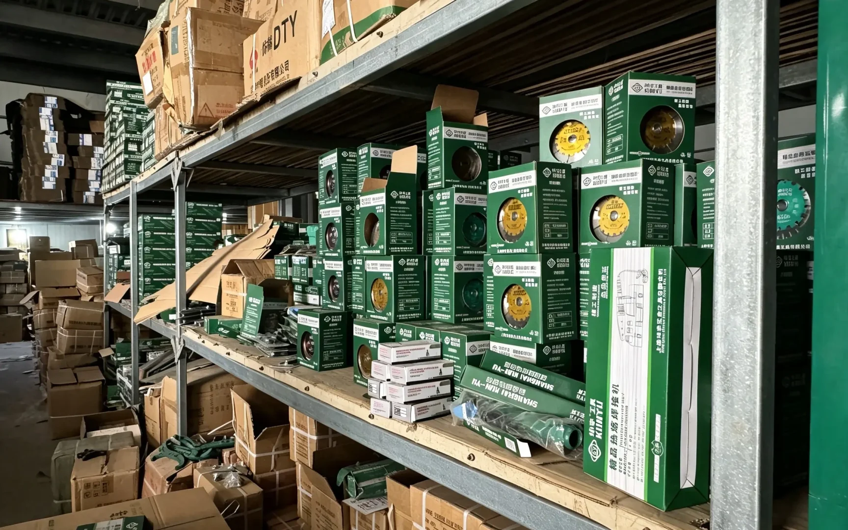 Boxed hardware hand tools on warehouse shelf, cutting discs & finished hand‑tool export stock